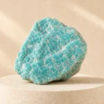 Amazonite raw stone on travertine