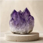 Amethyst raw stone on travertine