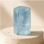Aquamarine raw stone on travertine