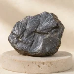 Hematite raw stone on travertine