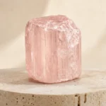 Morganite raw stone on travertine
