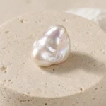 Pearl raw stone on travertine