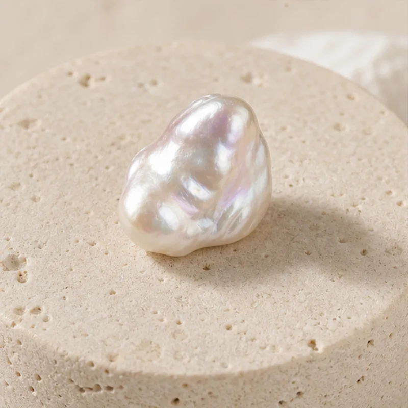 Pearl raw stone on travertine