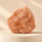 Sunstone raw stone on travertine